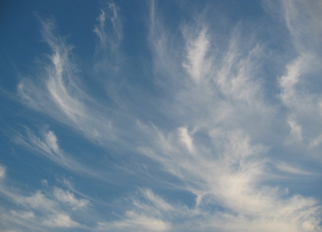 wispy clouds in a blue sky